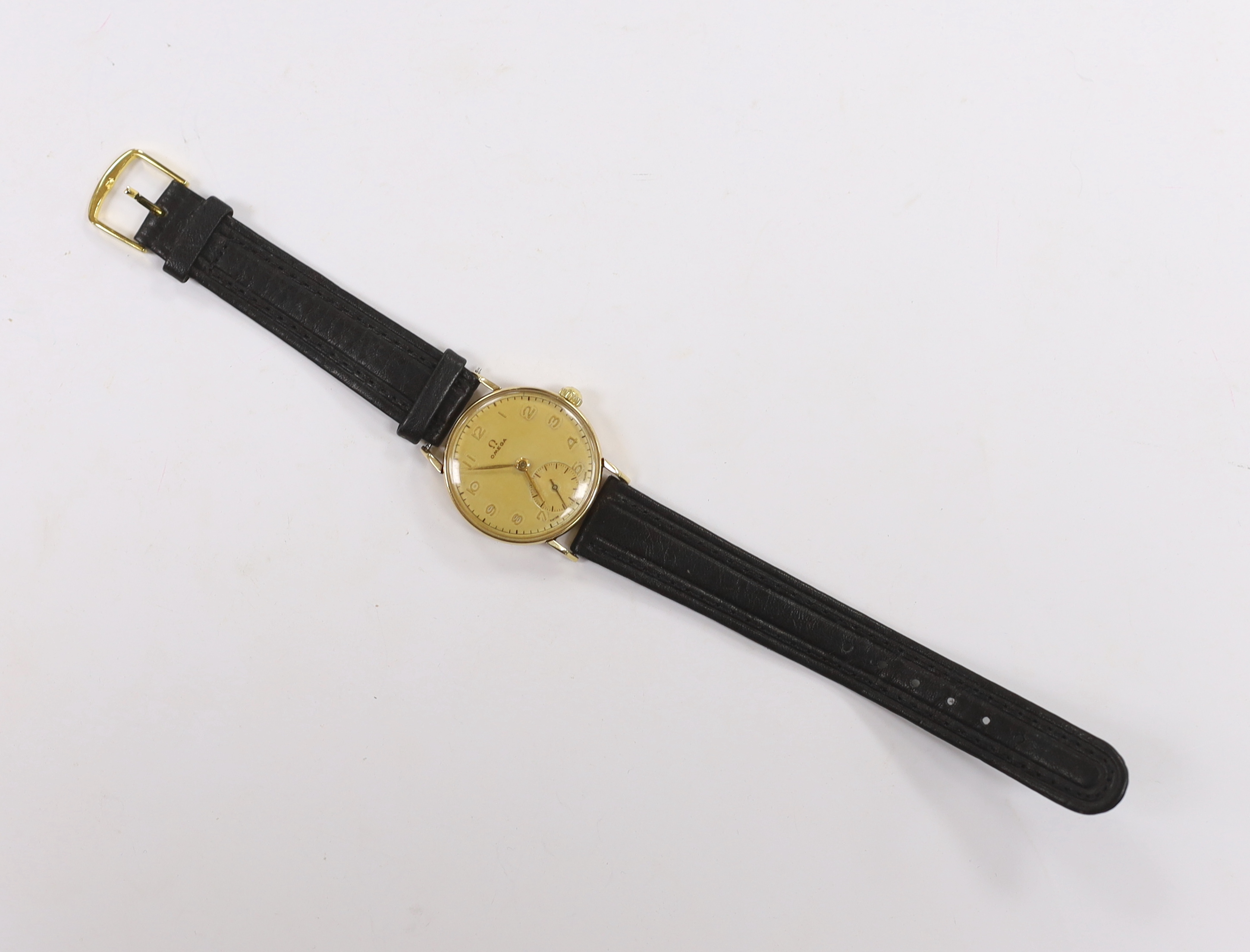A gentleman's mid 1940's 14ct gold Omega manual wind wrist watch, movement c.26.5.T3, case diameter 31mm, on later associated leather strap.